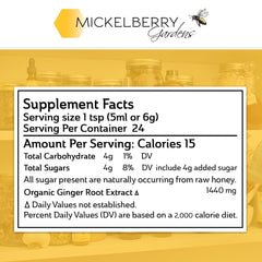 Close-up of Mickelberry Gardens label highlighting organic ginger and raw honey for natural wellness.