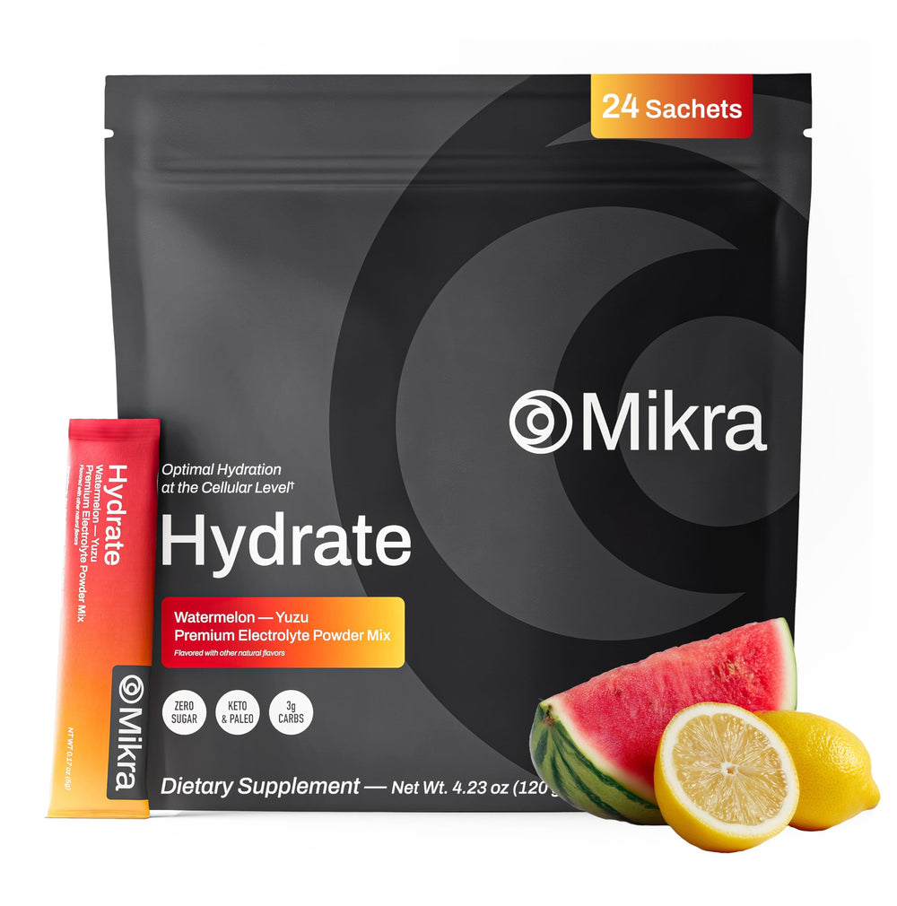 Mikra Hydrate Lemon Lime packet dissolving in a cup for quick hydration