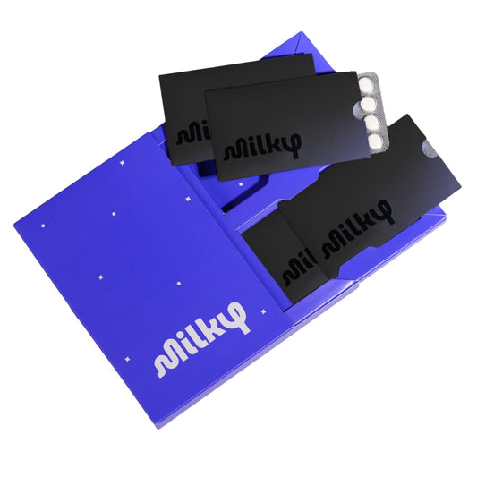 Milky lactase pills package front; compact dairy relief on the go.