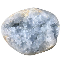 MOGEMT egg-shaped celestite geode highlighting sky blue tones for uplifting desk decor.