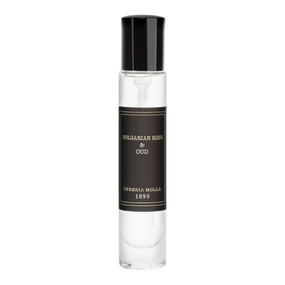 Molla 1899 handmade candle sits on shelf, elevating elegant room ambiance.