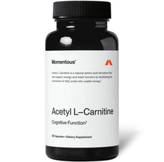 Momentous Acetyl L-Carnitine bottle closeup shows purity for cognitive support.