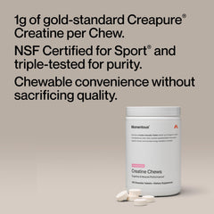 Close-up of Momentous Creatine Chews strawberry tablets ready to chew.
