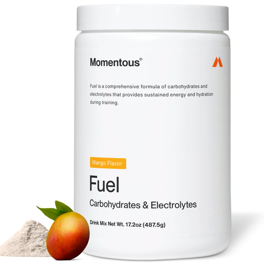 Momentous Fuel bottle pouring mango flavor for sustained energy during workouts