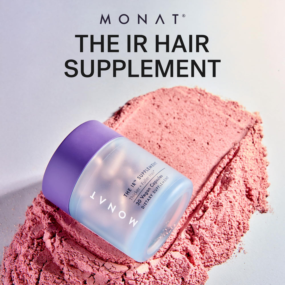 MONAT IR ingredient blend bottle close-up featuring biotin, zinc, and niacinamide.