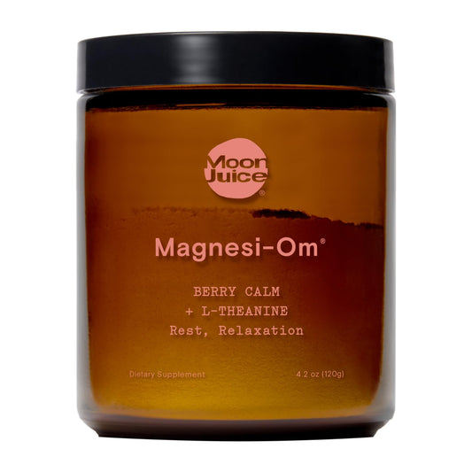 Moon Juice Magnesi-Om powder bottle showing the chelated magnesium blend for calm evenings.