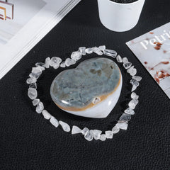 moonsix Heart-shaped Crystal Carved from ocean agate with unique color variations.