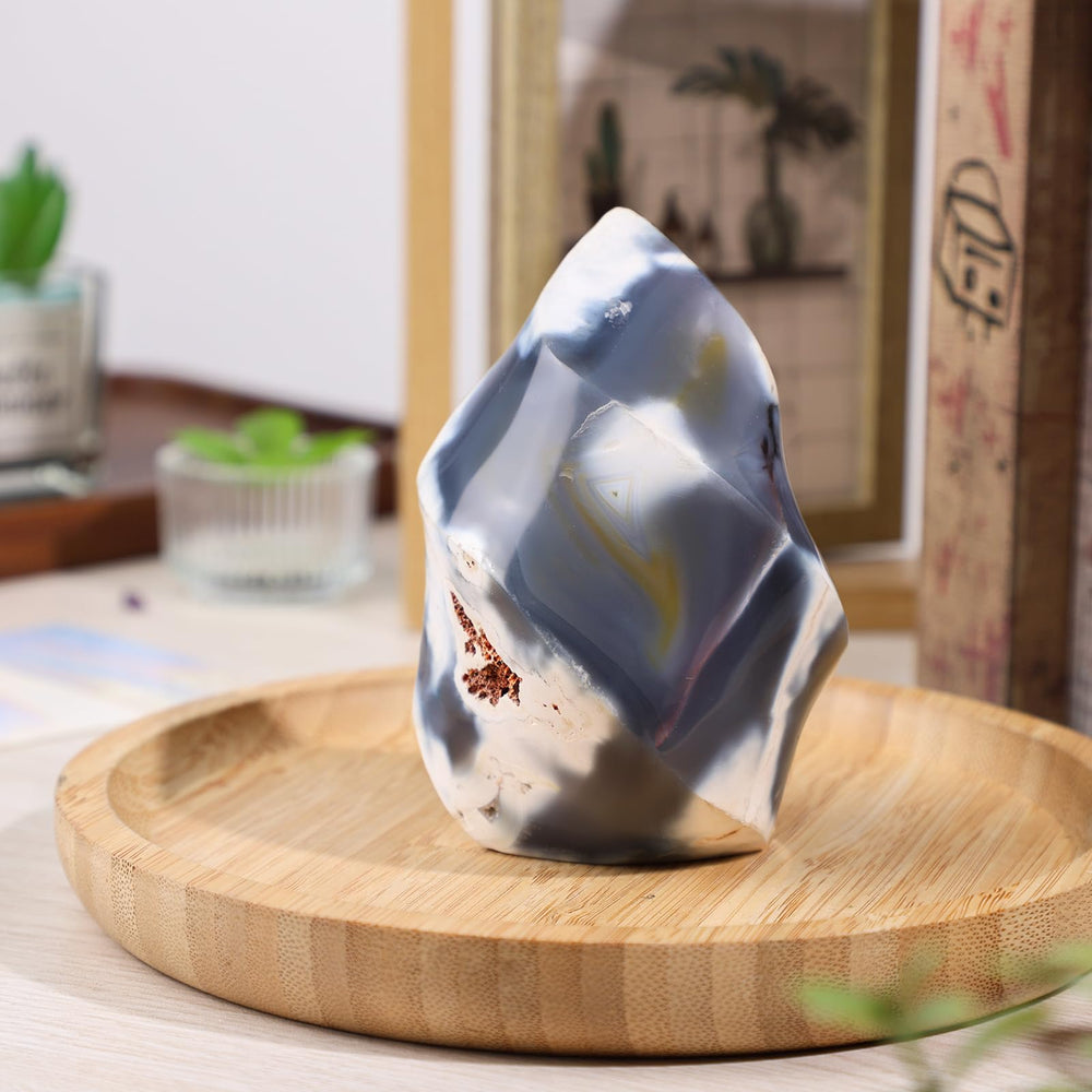 Moonsix orca agate flame tower on desk adds serene decor to workspace.