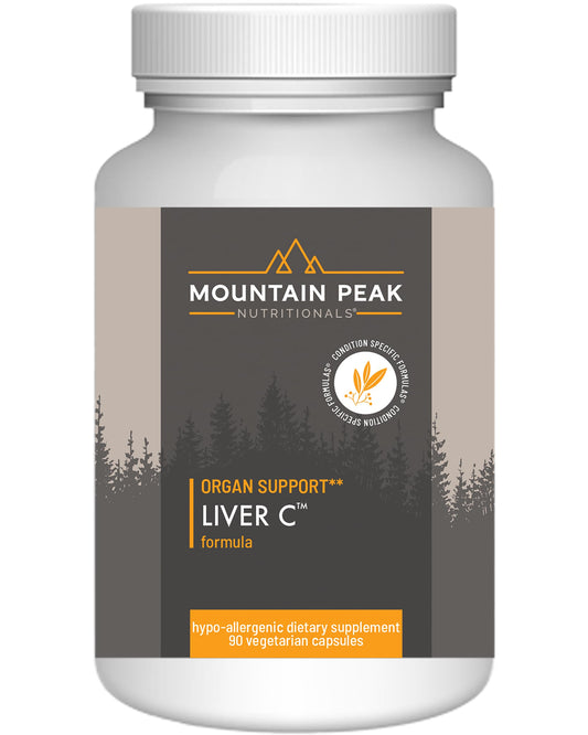 Mountain Peak Liver C bottle on table showcases herbal blend for daily liver support.