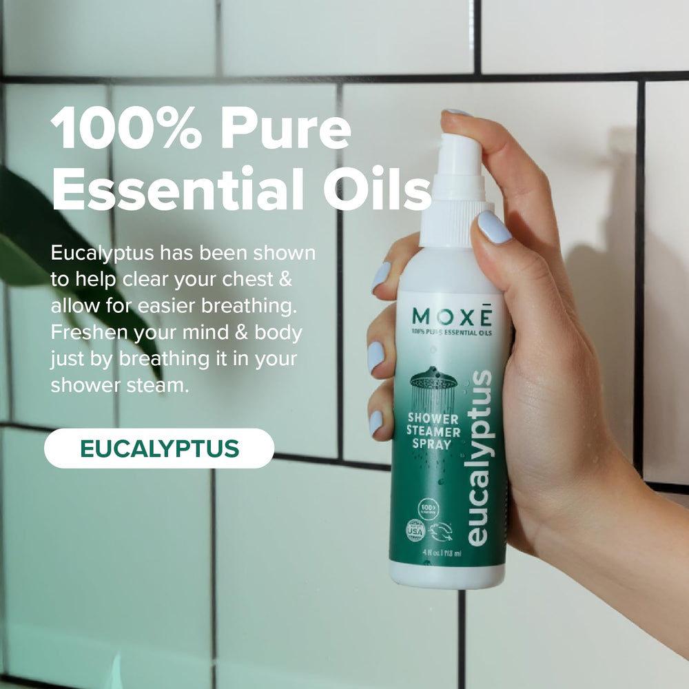 Close-up label on MOXE bottle highlighting 100% essential oils