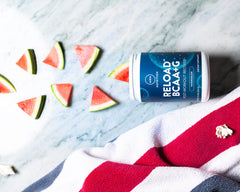 MRM Reload Watermelon bottle on table suggests on the go recovery