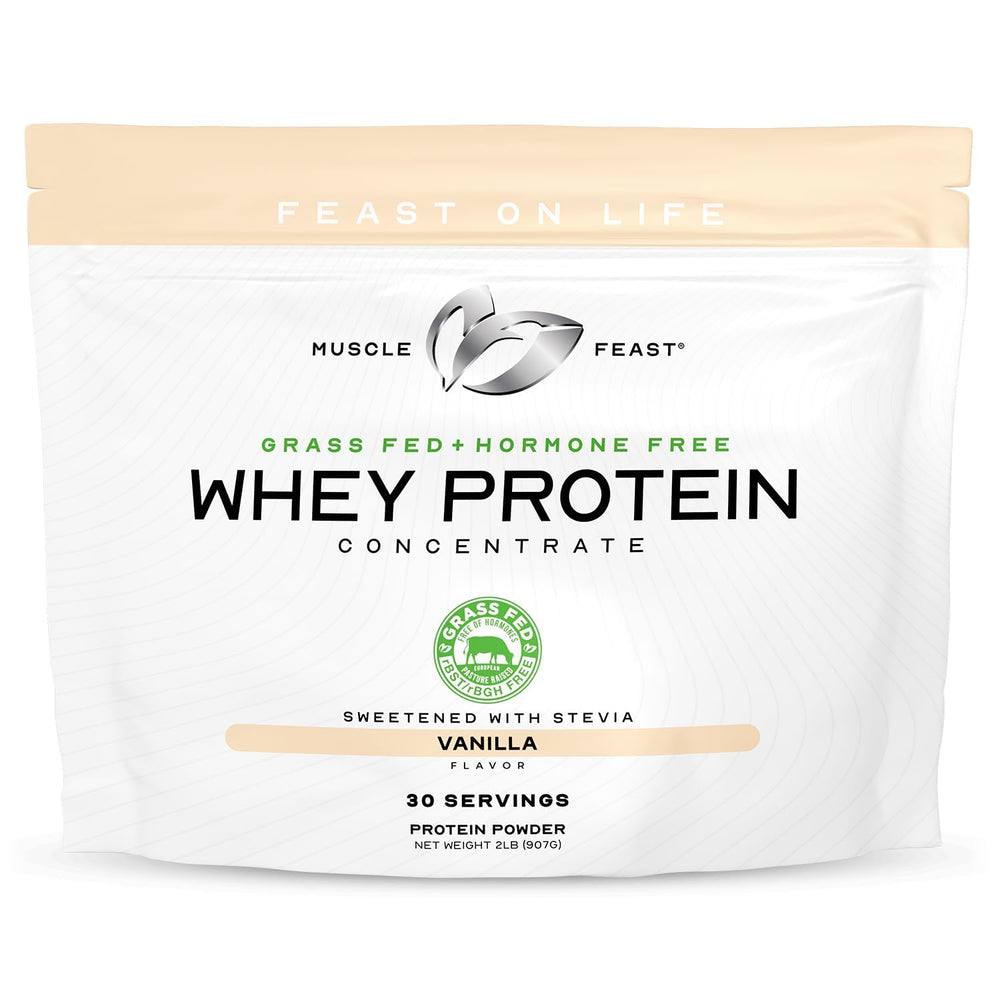 Muscle Feast grass-fed whey concentrate vanilla tub ready for a protein shake
