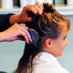 Anti-slip grip on My Hair Helpers lice comb for steady brushing through thick or curly hair.