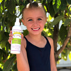 Happy child after using My Hair Helpers Mint Lice Spray for school.