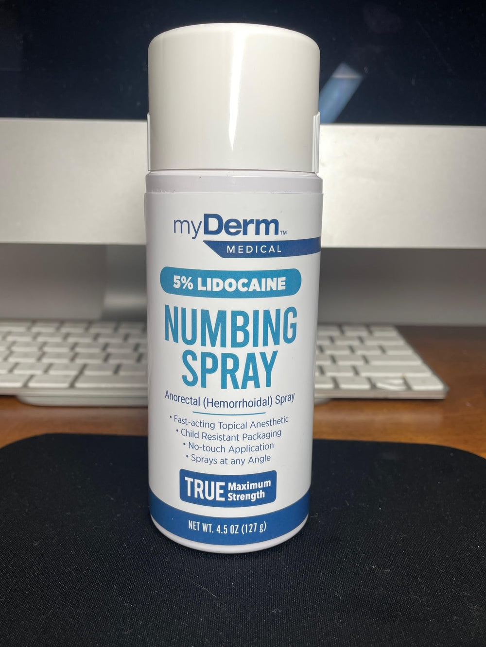 Myderm Three Pack Numbing Spray applicator close-up showing touch-free use.