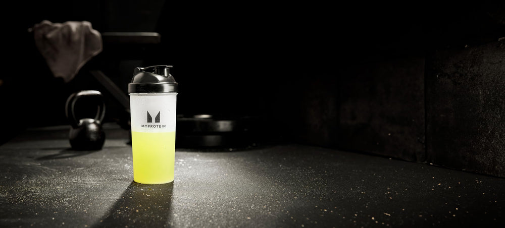 Myprotein HYROX Electro athlete running shows endurance-friendly hydration support.