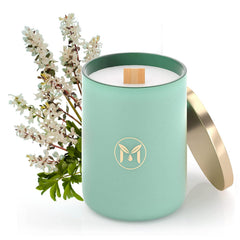 Myrrh Bliss of Essence Ocean Breeze candle in glass jar for relaxing living room ambiance.