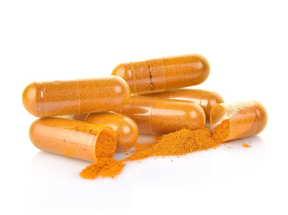 Nanocur capsules opened beside smoothie for quick boost.
