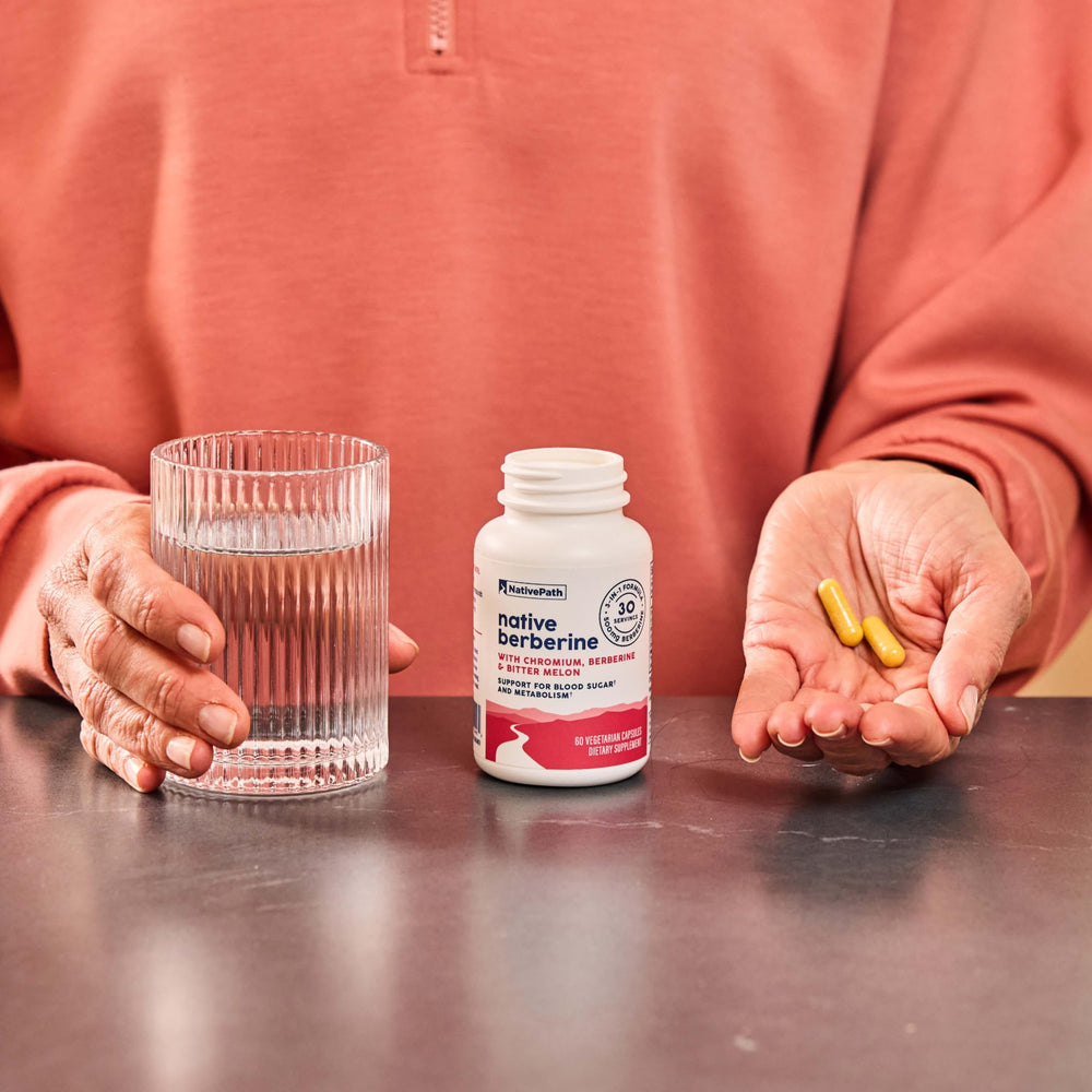 NativePath Berberine bottle with glass of water after meals.