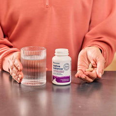 NativePath Native Balance capsules in hand for easy daily supplementation.