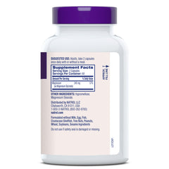 Natrol Magnesium Glycinate nightstand scene implying bedtime routine support.