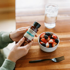 Nature's Sunshine Cranberry and Buchu capsules poured, convenient daily supplement.