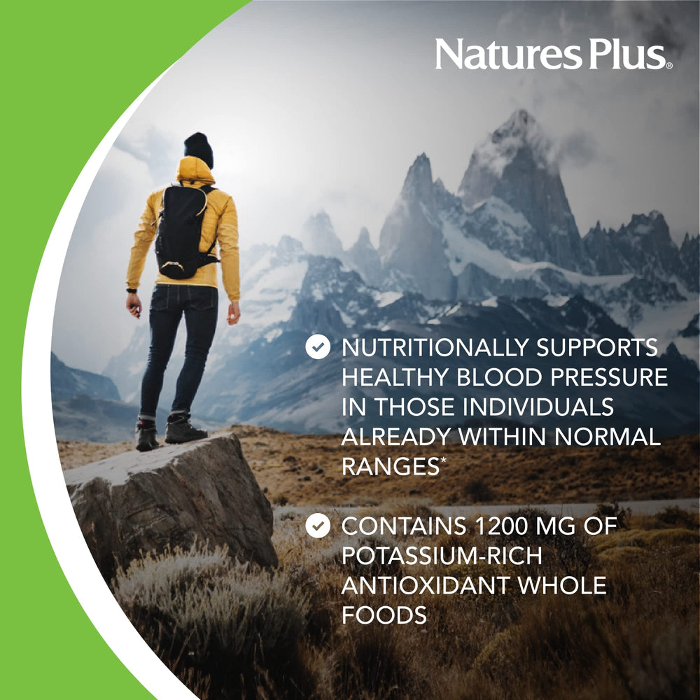 NaturesPlus AgeLoss tablets close-up showing compact daily capsules.