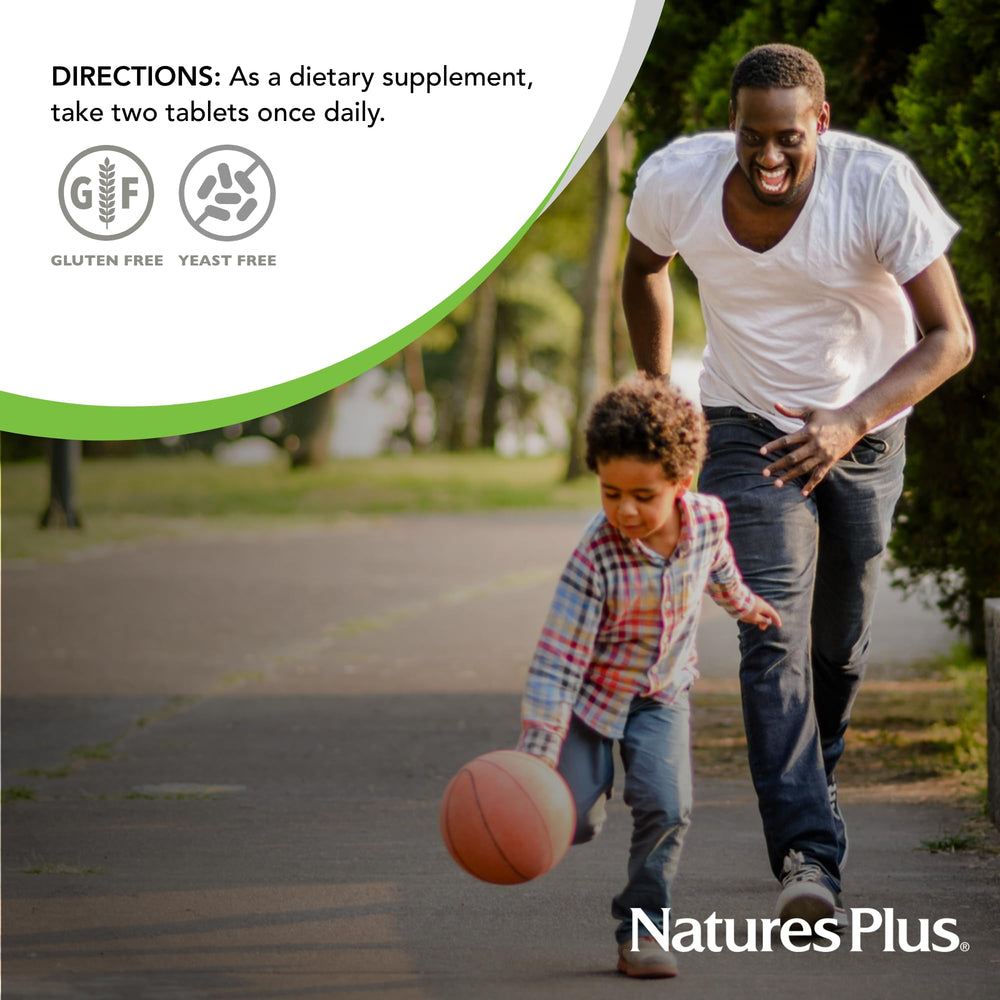 NaturesPlus Ultra Hair Plus tablets beside a glass of water for daily use