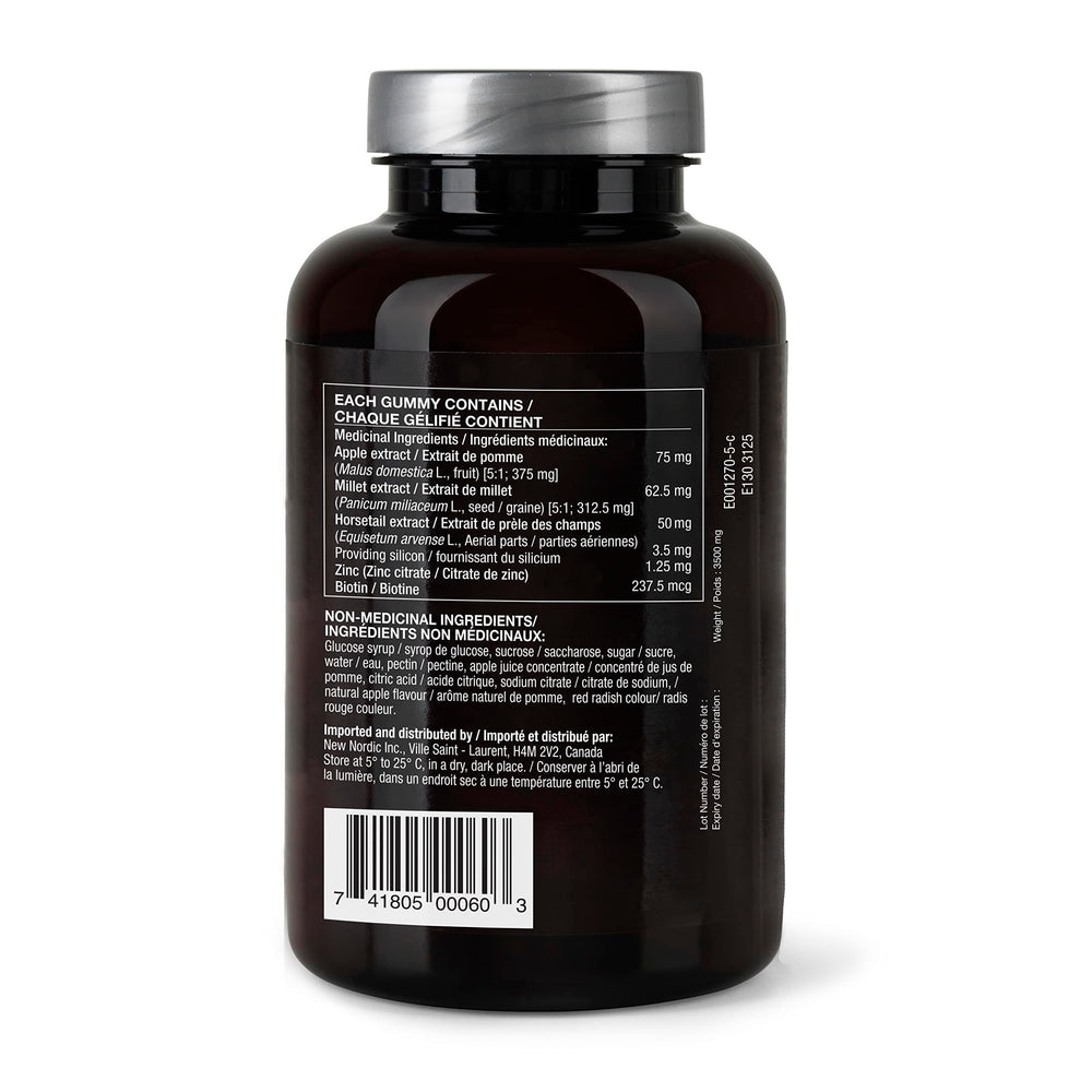 Close-up of New Nordic Hair Volume Gummies bottle showing vegan formula.