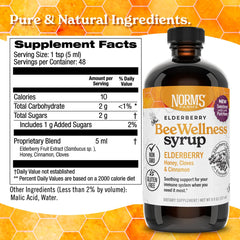 Norm's Farms BeeWellness elderberry syrup label highlights clove and cinnamon blend