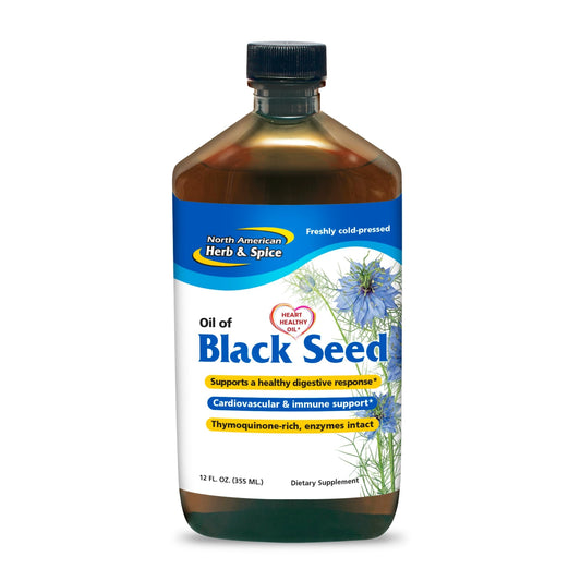 North American Herb & Spice Oil of Black Seed bottle on a kitchen counter for digestive support.