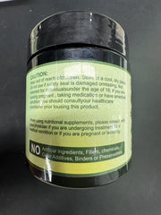Close-up of turmeric-ginger and herbal components in packaging.