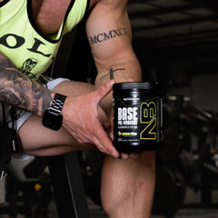 NutraBio Base Pre-Workout powder mixed in a glass with smooth texture and flavor