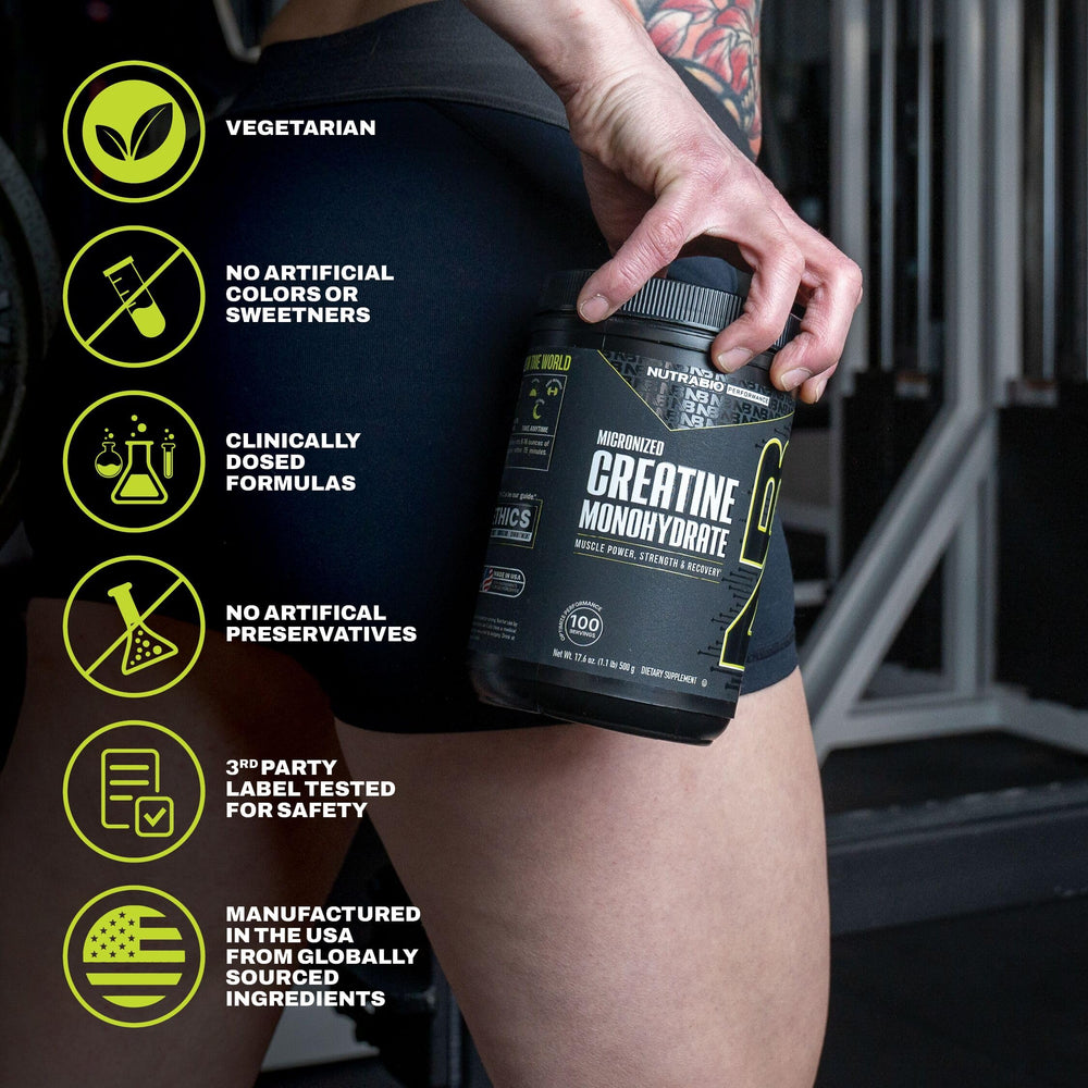 NutraBio creatine scoop measuring a daily dose for consistency.