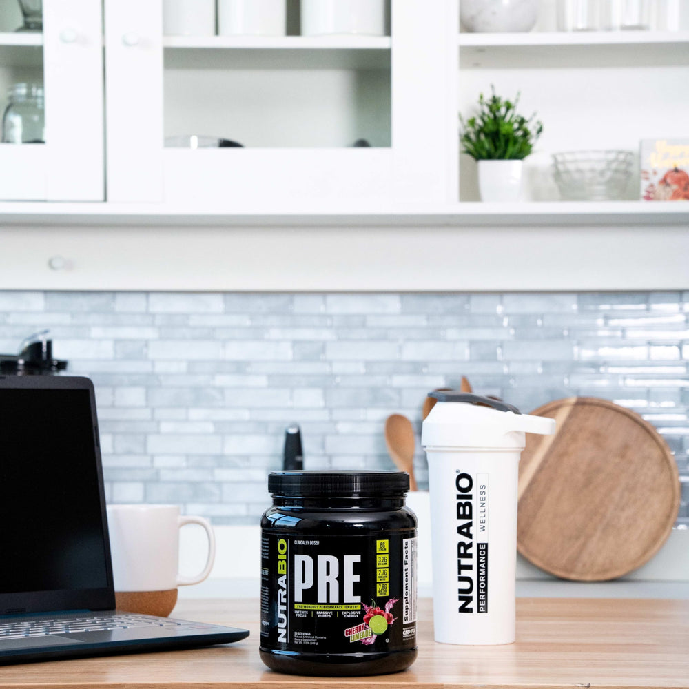 NutraBio PRE Workout Powder cherry limeade glass illustrates refreshing flavor during sessions.