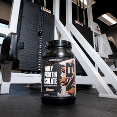 NutraBio Whey Isolate Smores milk glass demonstrates creamy shake