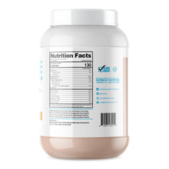 Scoop beside glass with ProteinOne whey powder for a shake.