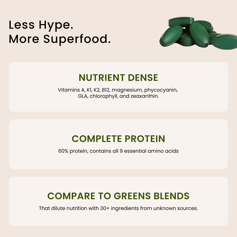 Nutrex Hawaii spirulina tablets on hand for convenient wellness support.