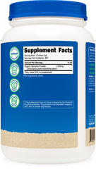 Nutricost spirulina powder in glass with spoon ready for nutrient-dense drinks.