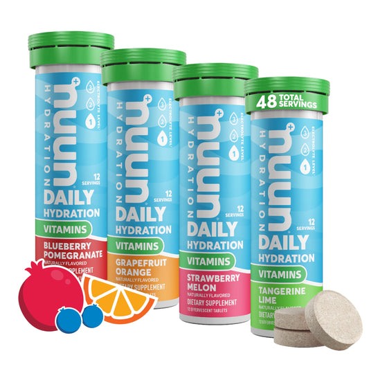Nuun Vitamins Blueberry Pomegranate tablet dissolving in water for a refreshing hydration boost