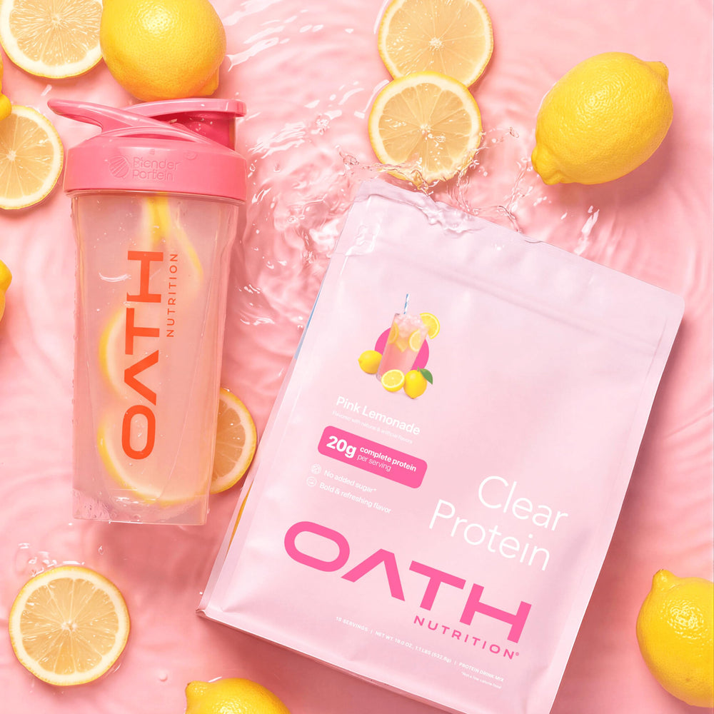 Shaker bottle with Oath Clear Whey Pink Lemonade being mixed after training.