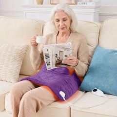OCTROT purple weighted heating pad in use on the back providing deep soothing warmth