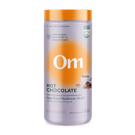 OM Mushroom Superfood hot chocolate canister on a counter, inviting daily ritual
