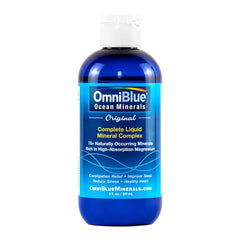 OmniBlue Ocean Minerals bottle poured into water for hydration support