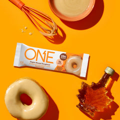 ONE Maple Glazed Doughnut bar in hand during a busy day.