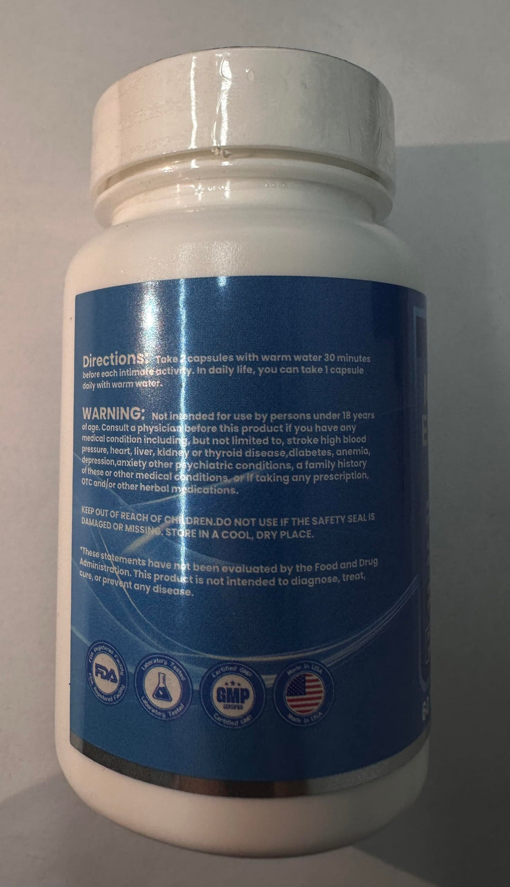 Oohma usage shot shows two capsules with water.