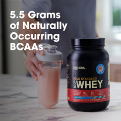 Optimum Nutrition Fruity Cereal whey pouring into a shaker for easy hydration.
