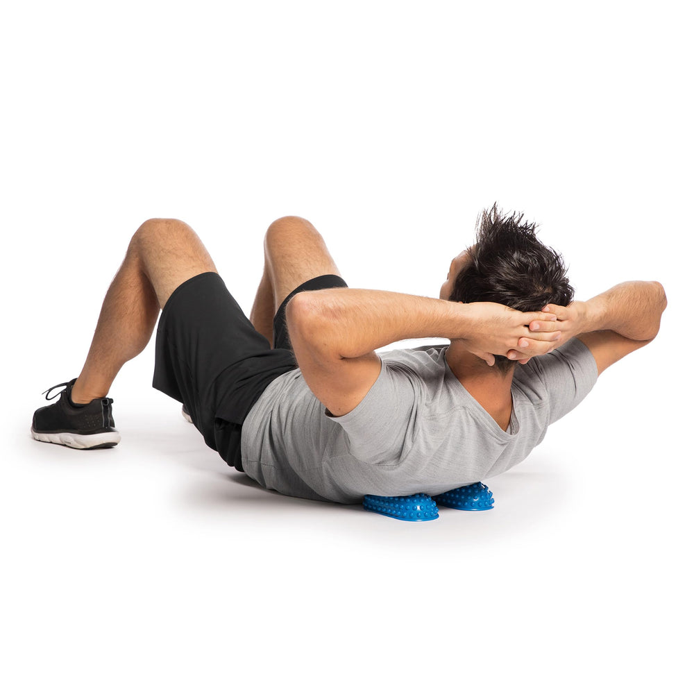 OPTP PRO-PODS in downward dog for wrist-friendly balance work.