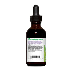 Pouring glycerite extract from Oregon's Wild Harvest bottle for herbal use