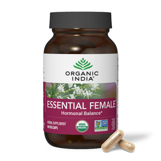 ORGANIC INDIA Essential Female bottle label highlights a herbal blend supporting hormonal balance.